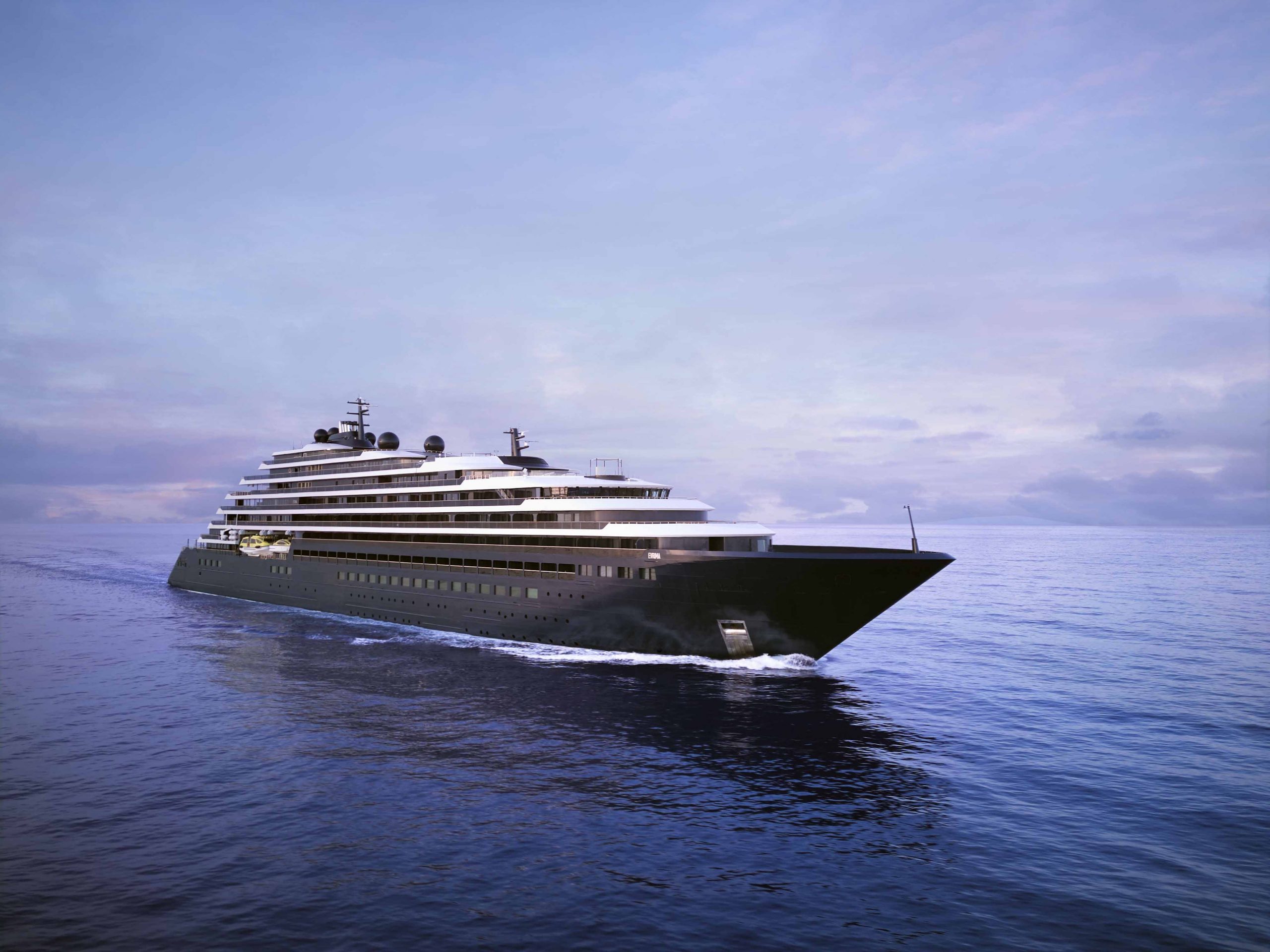 Luxury cruise ship sailing on calm ocean at sunset with a pastel purple sky above.