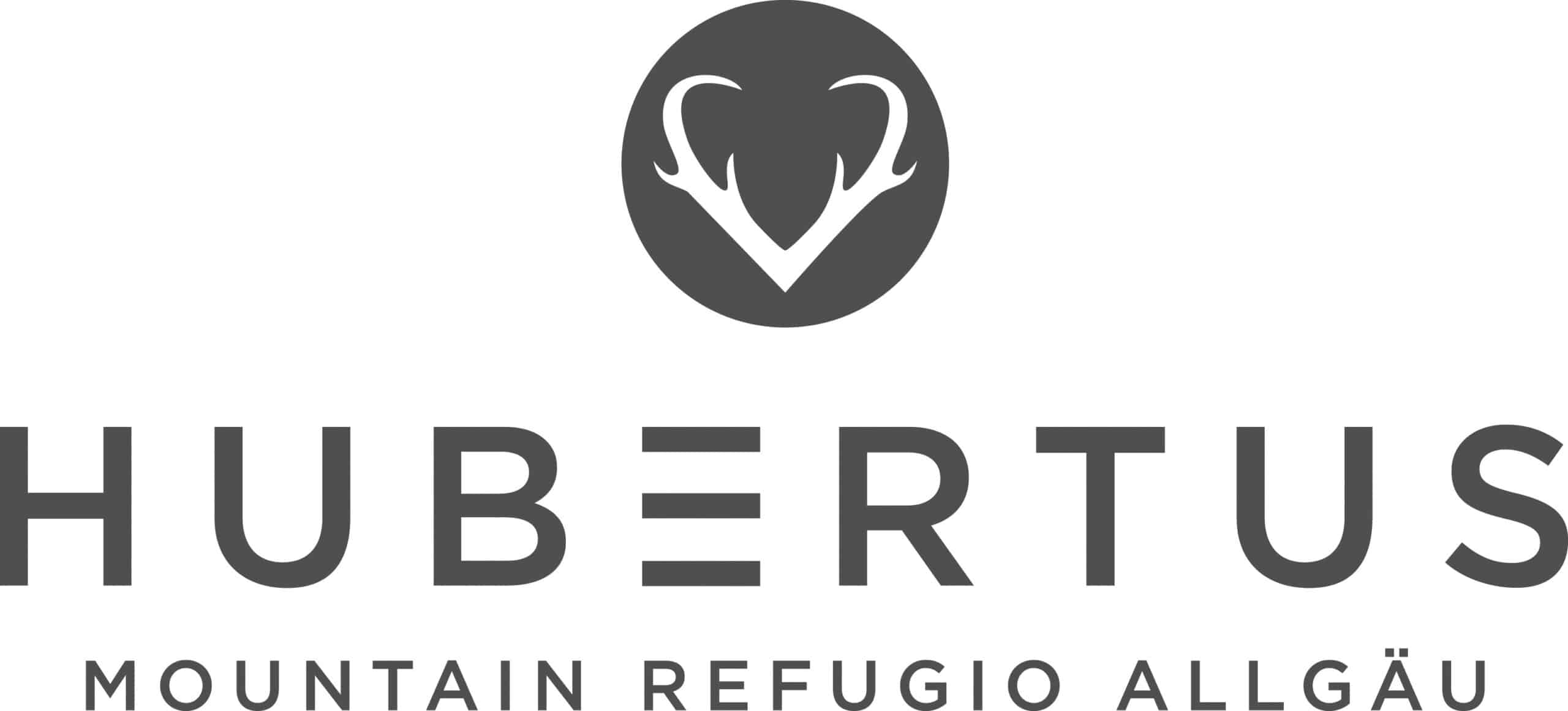 Hubertus Mountain Refuge Allgäu logo with a white deer-antler emblem inside a dark circle above the word HUBERTUS, followed by smaller text reading MOUNTAIN REFUGIO ALLGÄU.